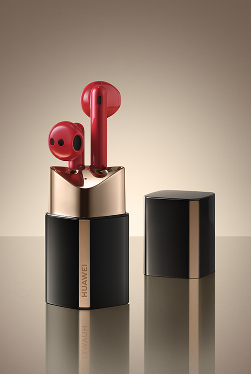 Huawei FreeBuds Lipstick headphones against gold background