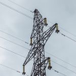 Electricity grid with grey sky background