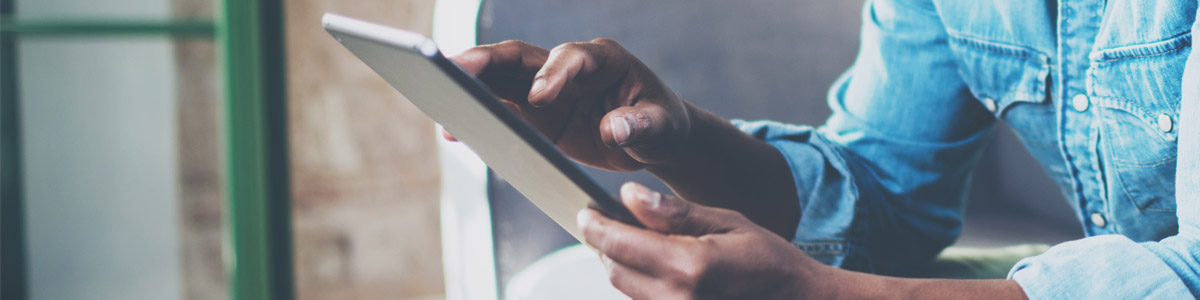 Man holding tablet device