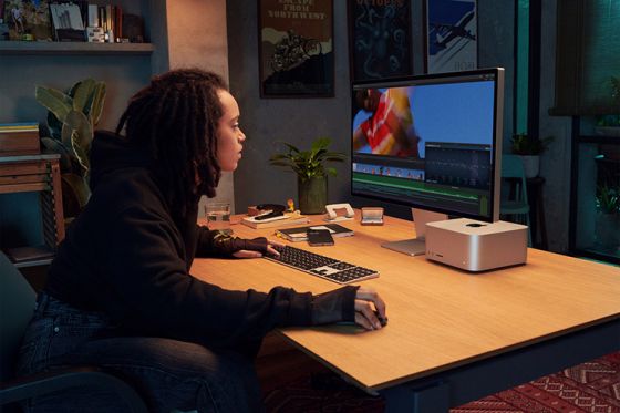 Person using Apple Mac Studio and Studio Display