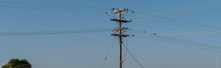 Electricity pole in blue sky background