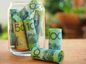 Australian bank notes in a glass jar