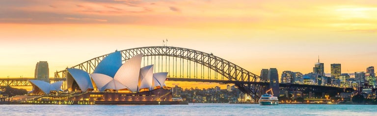 Sydney Harbour Bridge and Opera House with sunset background