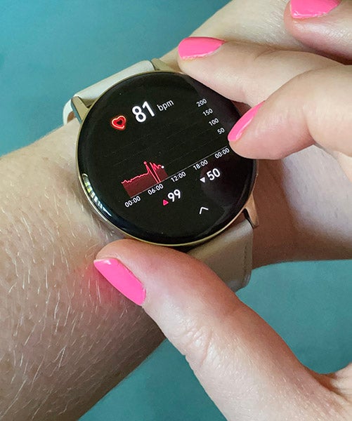 Person checking heart rate on Huawei GT 3 watch