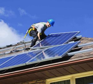 Man installing solar panels