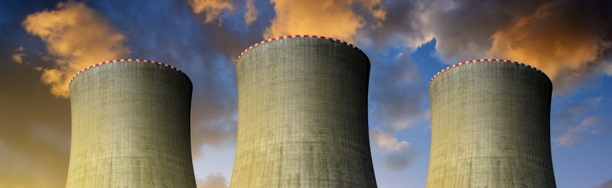 Coal power plants in sunset background emitting gases