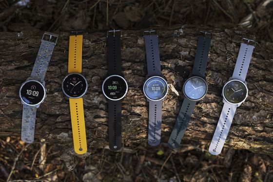 Range of Suunto Peak 5 watches on log outdoors