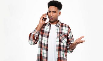 Man frustrated using mobile phone