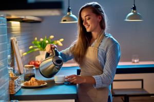 Woman using a kettle