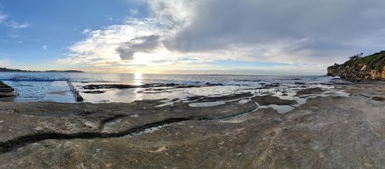 Panorama photo of sunrise over ocean