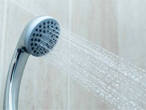 Hot water running from shower head.