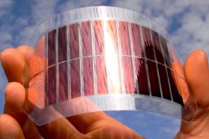 Hand holding solar cells in sunlight