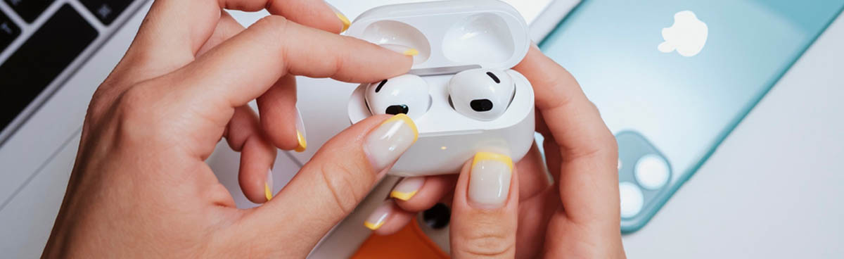 Wireless earbuds in a woman's hands