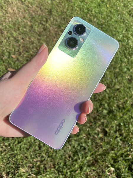 OPPO Reno8 Lite 5G rainbow phone being held