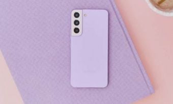 Purple smartphone on a purple notebook