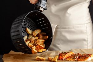 pouring chips from airfryer 