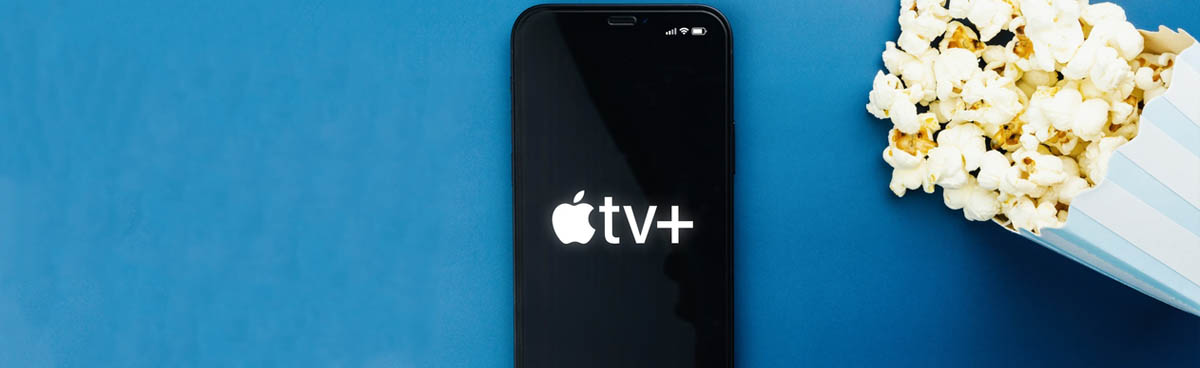 Smartphone showing Apple Tv+ logo next to popcorn
