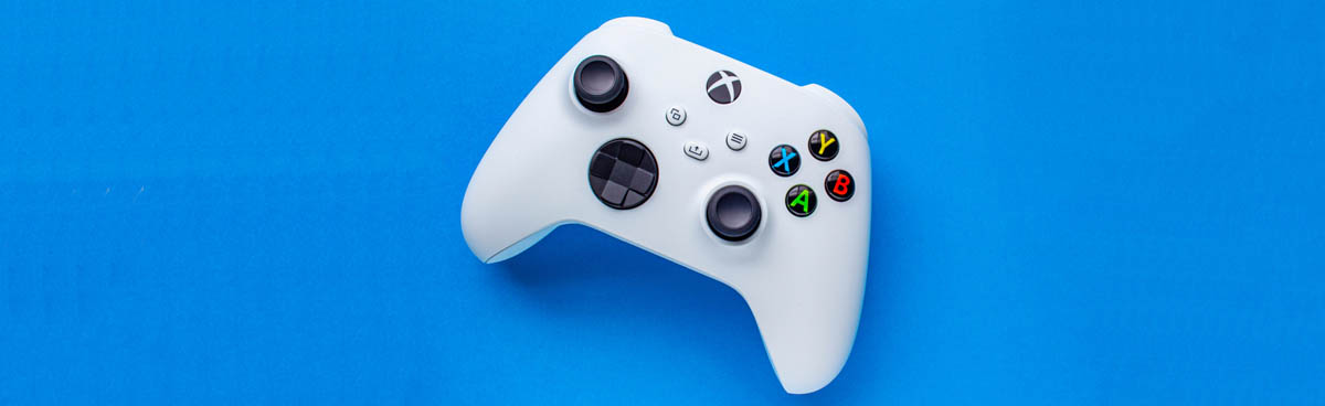 White Xbox controller on blue background