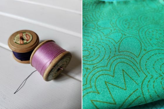 Closeup photos of purple thread spools and green fabric