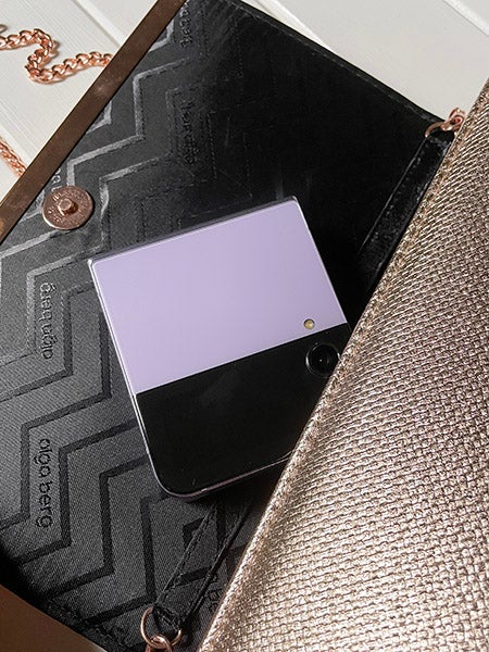 Samsung Galaxy Z Flip4 phone in purple in handbag