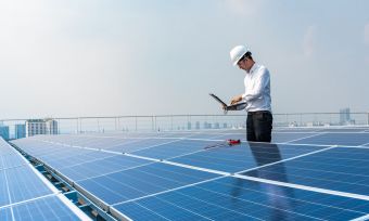 man inspecting panels