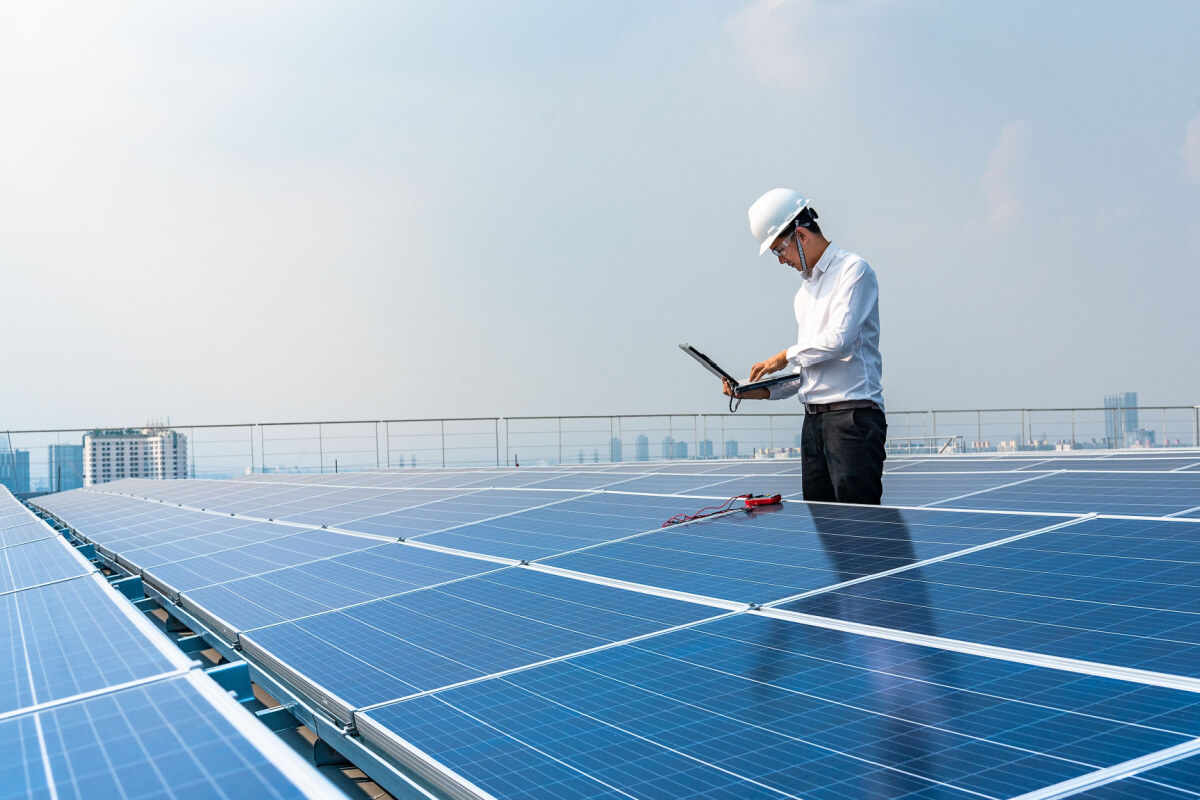 man inspecting panels