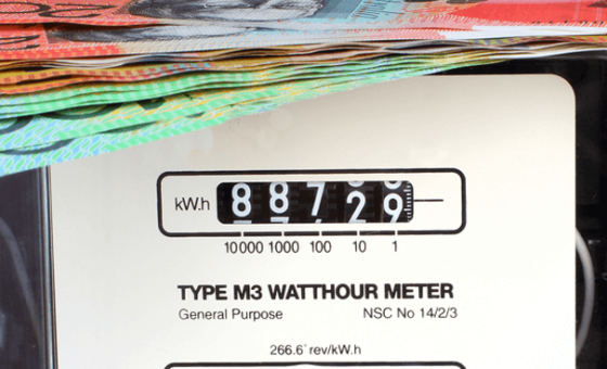 An electricity meter with Australian banknotes on top