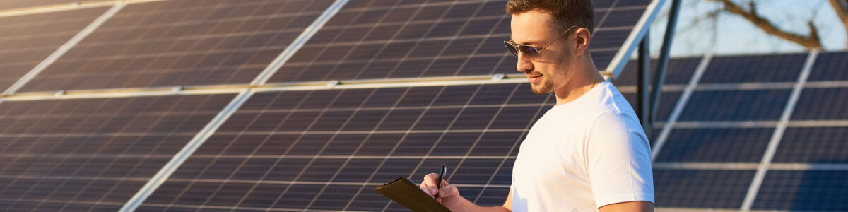 man with solar panels