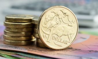 Australian gold coins on top of $5 and $10 notes.