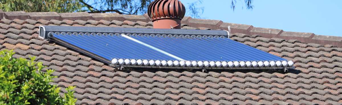 Evacuated solar tubes on rooftop for hot water system.