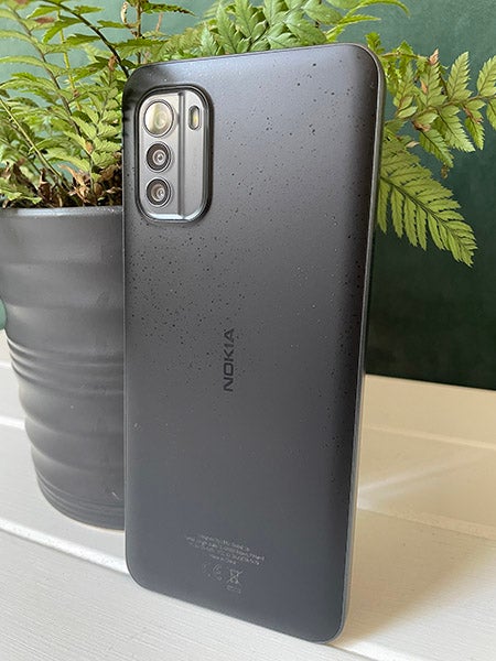 Back of Nokia G60 5G phone with pot plant