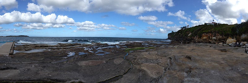 Panorama photo of rock pools and ocean taken on Nokia G60
