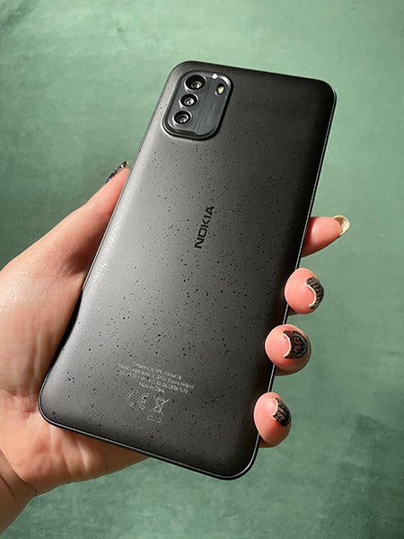 Person holding Nokia G60 phone