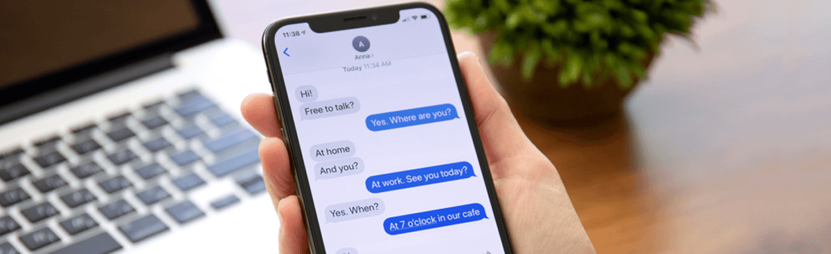 Person using iMessage on an iPhone