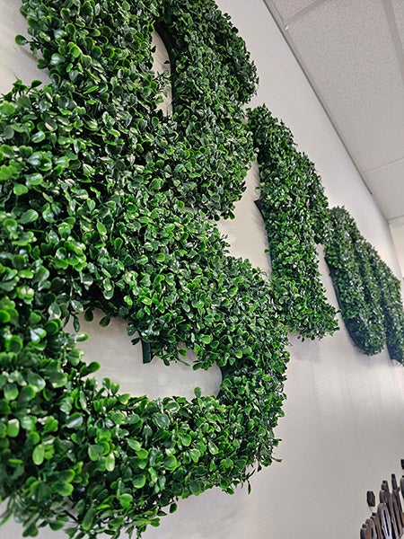 Photo of wall text made from plants