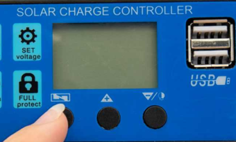 Hands touching button on blue solar charge controller.
