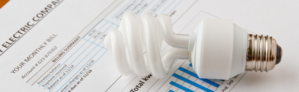 Lightbulb on top of an electricity bill.