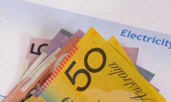 Australian bank notes against electricity bill