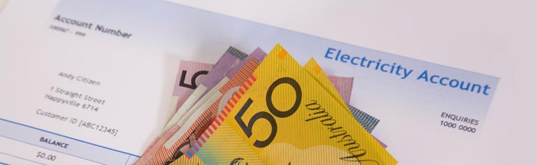 Australian bank notes against electricity bill