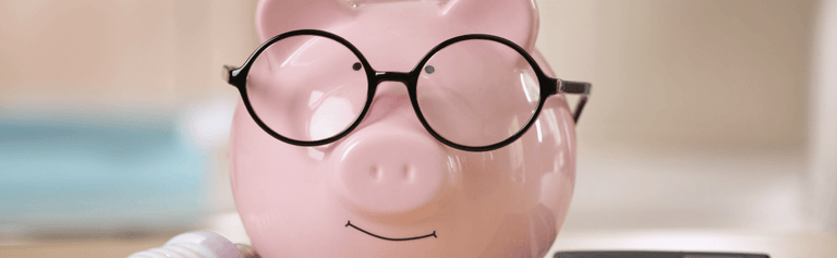 Piggy bank wearing glasses.
