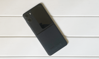 OPPO Find N2 Flip phone in black on white wooden background