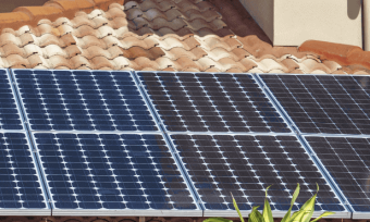 Close up of solar panels on a rooftop.