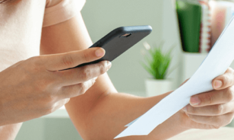 Woman paying phone bill