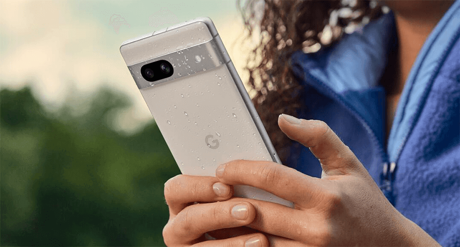 Woman holding white Google Pixel 7a phone in rain