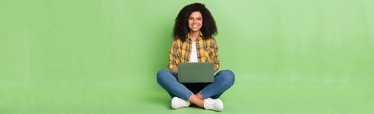 Smiling woman using laptop