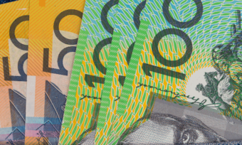 Australian money sitting in jean pocket.