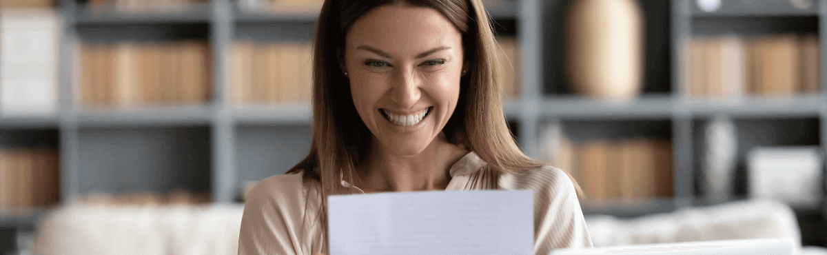 Woman looking ecstatic at her energy bill.