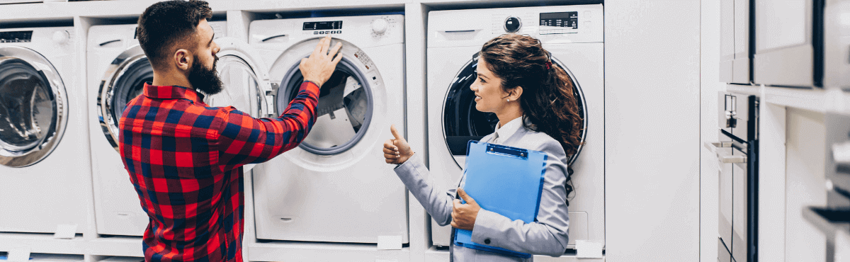 Woman selling new washing machine to man.