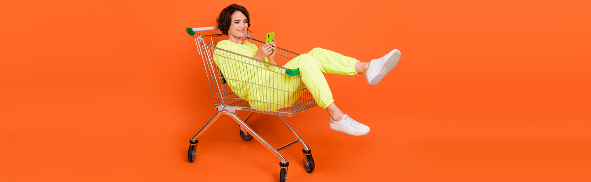 Everyday Mobile phone plans review image with woman in trolley with phone