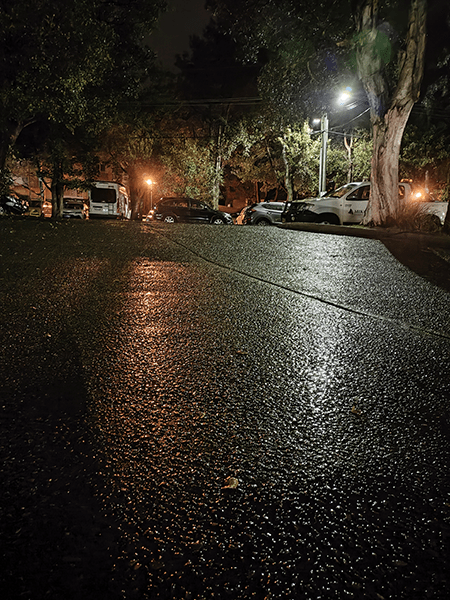 Photo of wet driveway at night